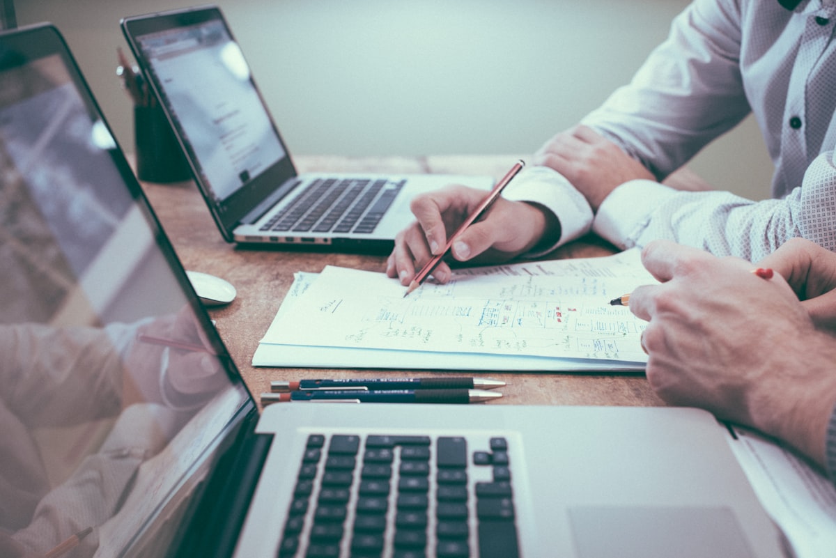 Documents spread on a table during a financial planning discussion